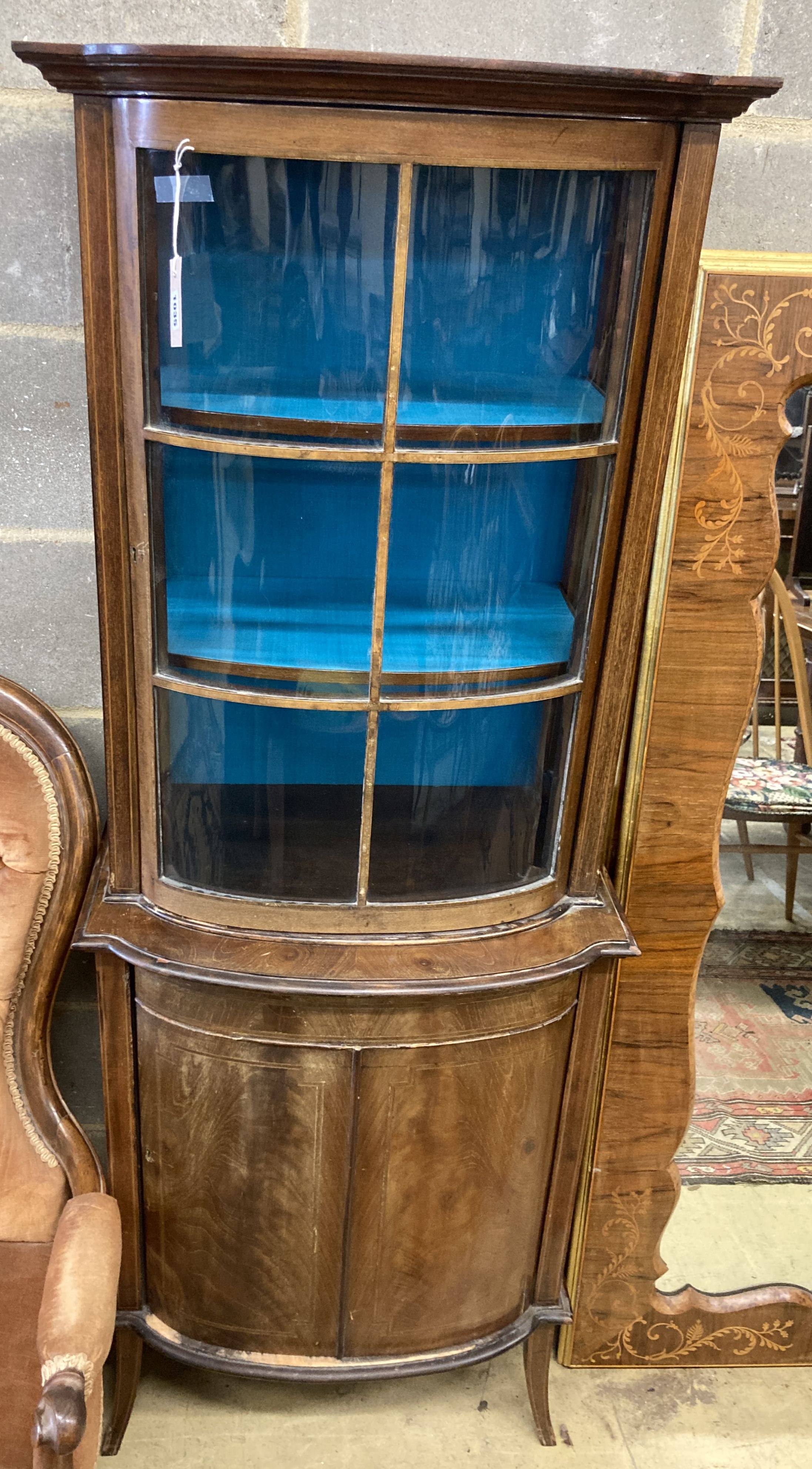 An Edwardian mahogany bowfront narrow display cabinet, width 60cm, depth 36cm, height 164cm